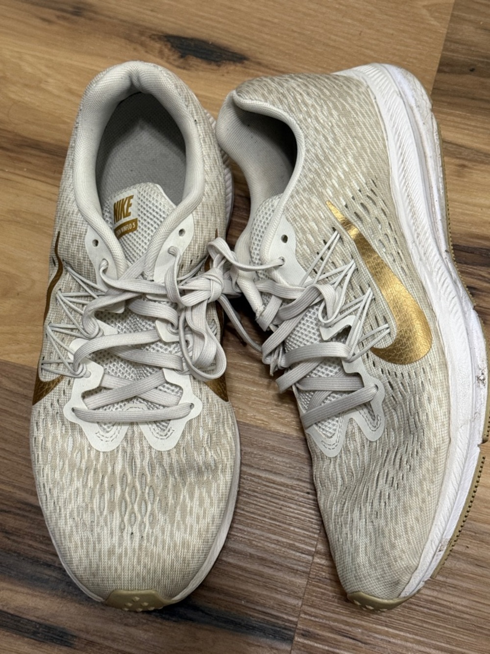 Nike Women's Athletic Sneakers in Beige with Gold Swoosh